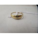 An 18ct gold single stone, rubover set band ring