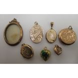 Seven assorted 9ct gold and gold coloured metal lockets: to include an oval finely engraved example