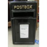 A black painted cast metal post box  17"h  9.5"w