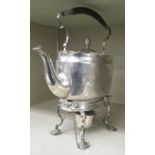 An Edwardian silver kettle of oval form with a fixed, insulated top handle, hinged lid and S-