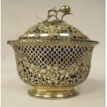 A reproduction of a Georgian silver latticeworked, floral and scroll cast and chased oval pot pourri