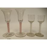 A pair of 18thC wine glasses, circa 1760, each faintly vertically moulded bucket shaped bowl on an