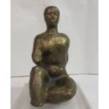 A patinated bronze sculpture, a seated woman, on a Perspex plinth  bears an indistinct signature