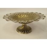 A late Victorian silver wrythen moulded reed bordered sweet dish with a decoratively pierced, wavy