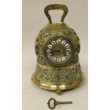 A late 19thC French brass novelty mantel timepiece, cast in the form of a bell with Latin