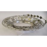 An Edwardian silver wire oval grape basket, having a swing handle, decorated with fruiting vines and