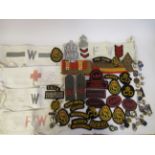 Various British World War II Civil Defence and ARP cloth and metal badges and armbands (Please Note: