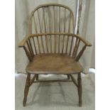 A 19thC oak and elm framed, low hoop and stick back Windsor chair with level arms on angled