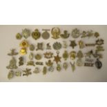 Approx. fifty military cap and other badges, some copies: to include Indian Regiments, Hyderabad