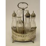 A George III silver oval cruet stand with decoratively engraved, pierced and applied wire sides