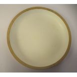 A John Makepeace turned, softwood and moulded cream coloured laminate lined platter  bears a