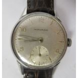 A 1950s Movado stainless steel cased wristwatch, faced by an Arabic and baton dial, incorporating