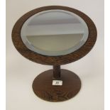 A 1960s John Makepeace Wenge wood vanity mirror, set with an 8"dia bevelled plate, on an adjustable,