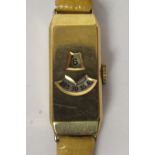 A ladies Art Deco 9ct gold cased digital watch, Cal 90 A5M, on a tan hide strap
