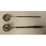 A 19thC silver coloured metal punch ladle with a circular bowl, on a carved and elliptically