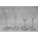 A pair of mid 18thC wine glasses with plain bell shaped bowls, each on a clear airtwist stem and a