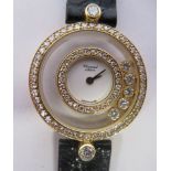 A ladies Chopard of Geneve, Happy Diamonds 18ct gold cased and diamond set wristwatch, no 20/3957,