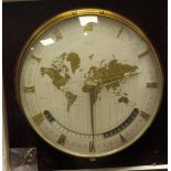 A 1960s Kienze lacquered brass cased World Clock, the mechanical movement faced by a silvered