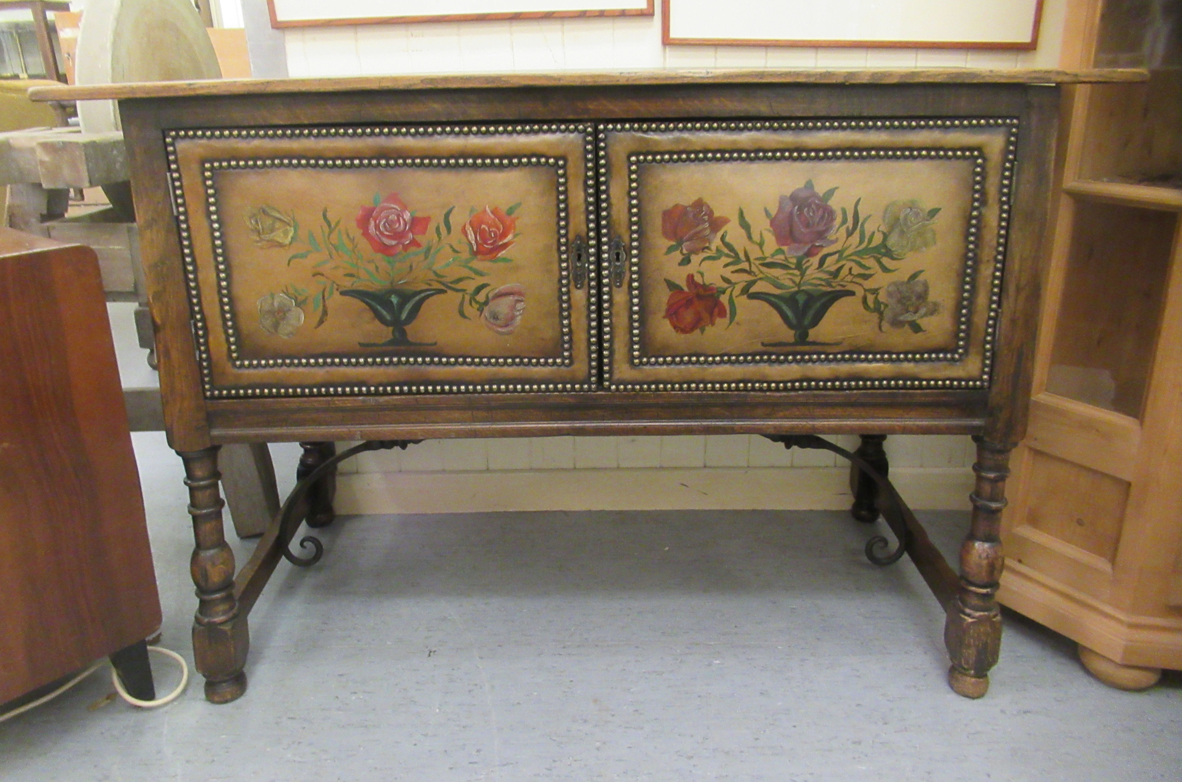 An early 20thC oak two door sideboard, raised on turned, block legs  34"h  51"w