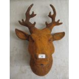 A rust coloured cast iron stag's head  26"h