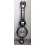 A Regency satinwood inlaid mahogany cased wheel barometer with a silvered dial, inscribed M Riva,