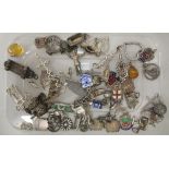 Silver and white metal bracelet charms: to include a camel, a shoe and a crucifix