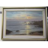 H L Braunston - a shoreline scene at sunset  oil on canvas  bears a signature  20" x 29"  framed