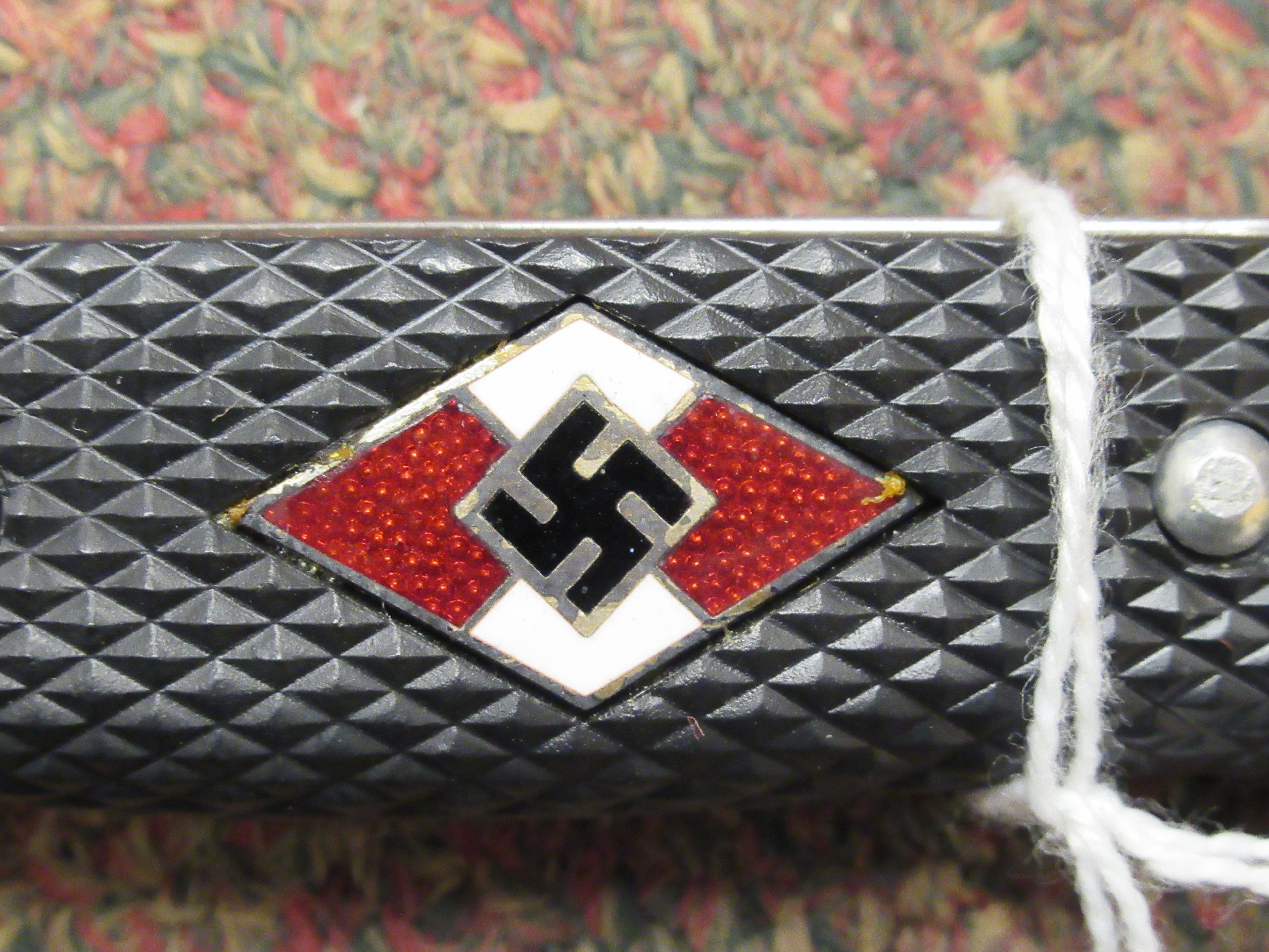 A Hitler Youth dagger, the rivetted grip plate incorporating a red, white and black enamelled - Image 6 of 6