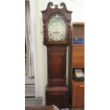 A mid 19thC oak and mahogany longcase clock, the hood with a swan neck pediment, over an arched