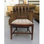 An early 20thC Georgian design mahogany framed open arm chair, the tapestry covered drop-in seat