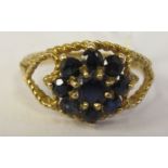 A 9ct gold claw set sapphire cluster ring