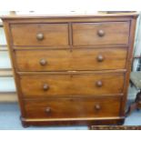 A late Victorian mahogany dressing chest with round corners, comprising two short/three graduated