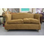 A modern textured fabric upholstered two person settee with an arched back and level arms, raised on