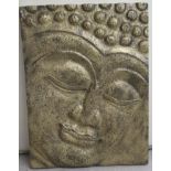 A modern gilt sprayed and moulded composition plaque, the face of a Buddha  17.5" x 23"