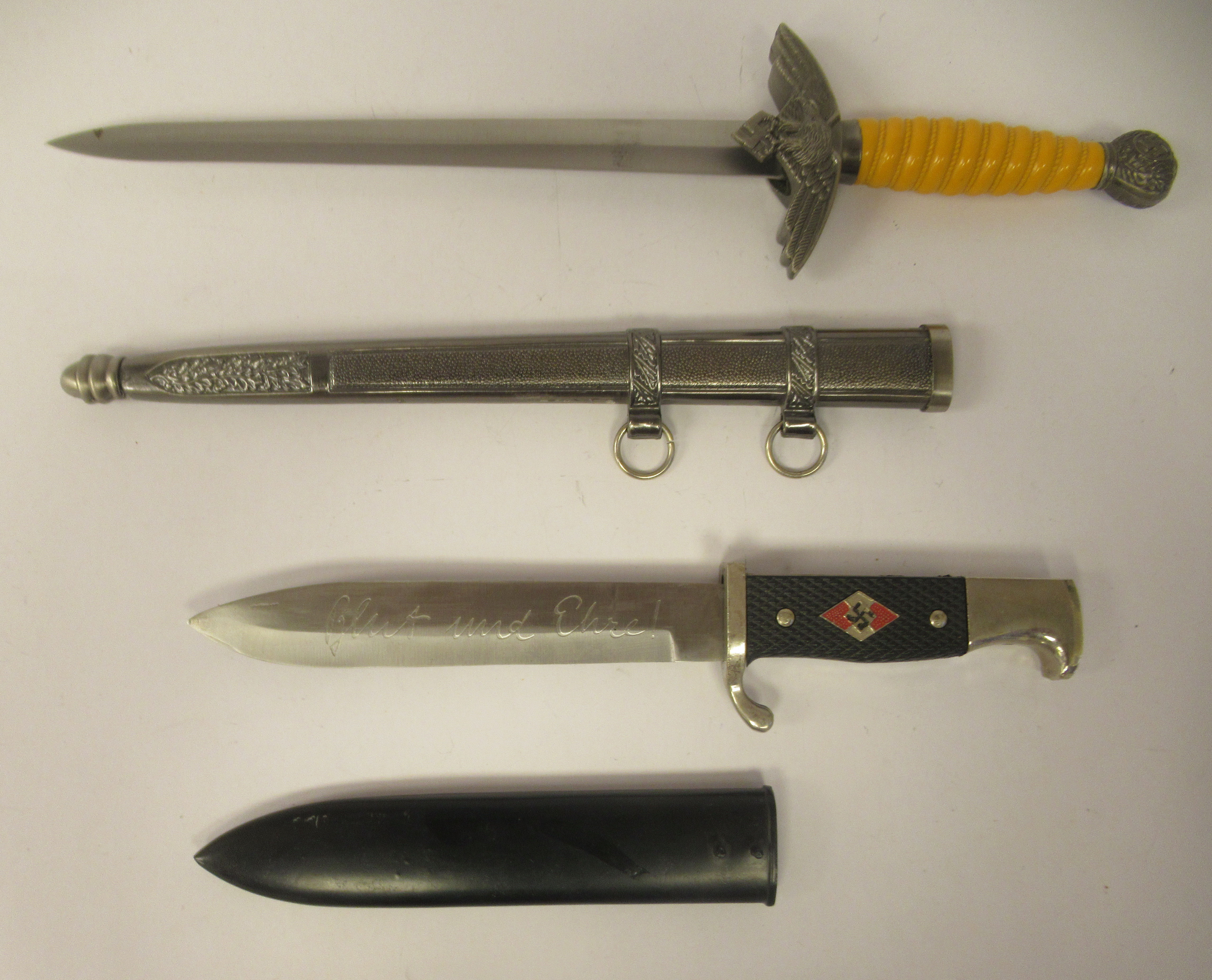 Four replica Third Reich era bladed weapons, viz. a Hitler Youth dagger, in a steel sheath; two - Image 4 of 4