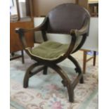 An early 20thC Continental stained beech framed throne chair, raised on arched feet