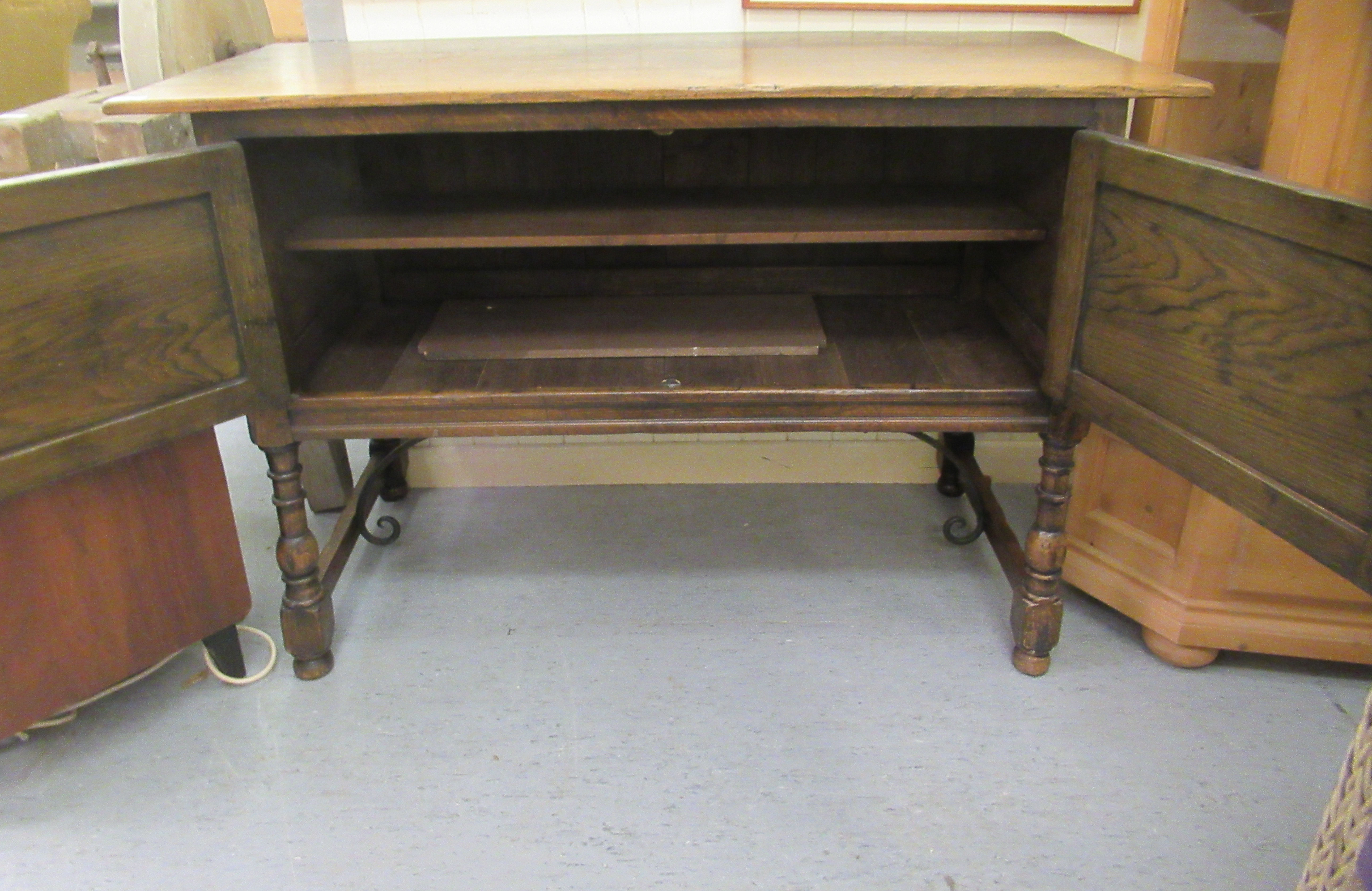 An early 20thC oak two door sideboard, raised on turned, block legs  34"h  51"w - Image 2 of 3