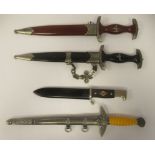 Four replica Third Reich era bladed weapons, viz. a Hitler Youth dagger, in a steel sheath; two