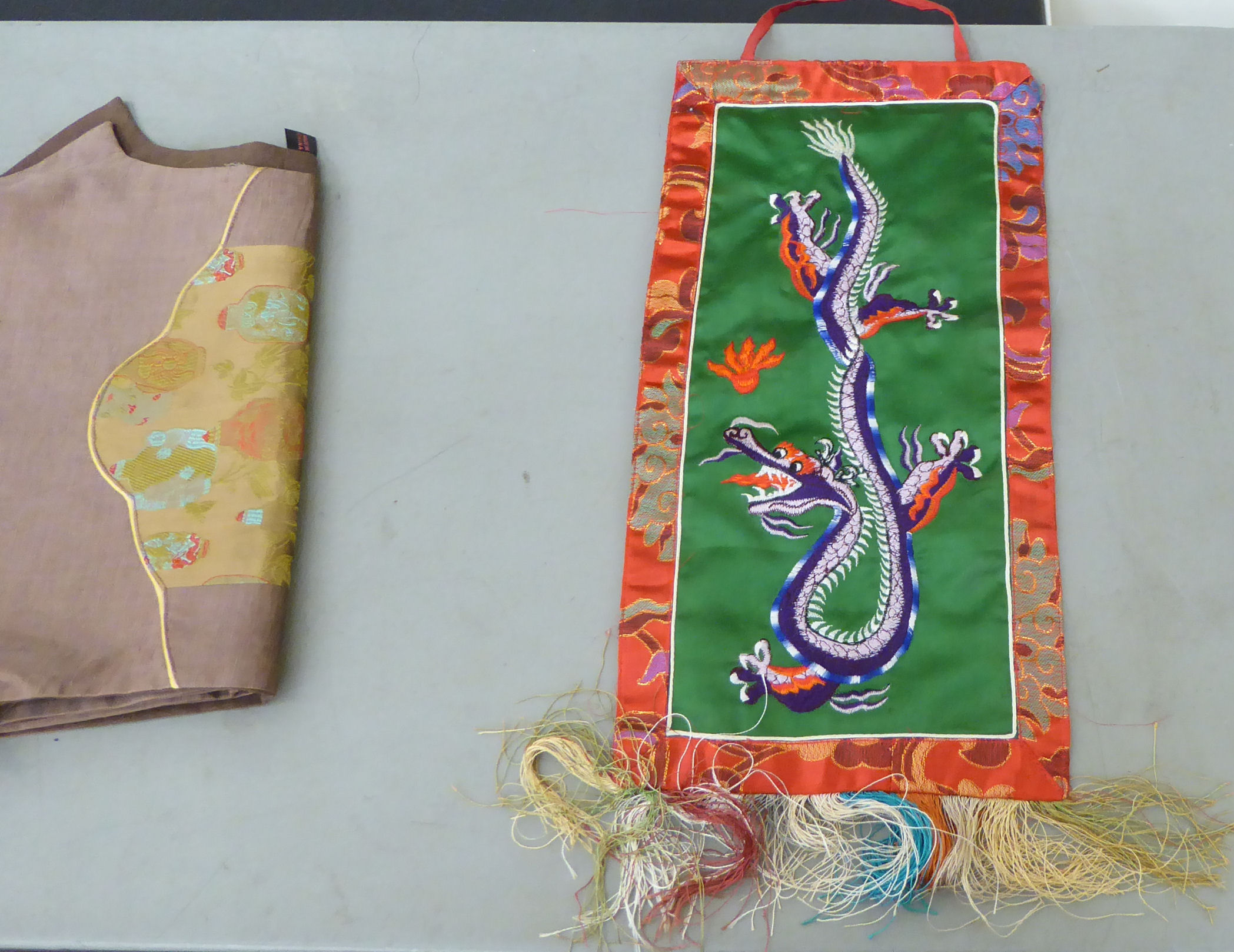 20thC Chinese textiles: to include a fabric hanging panel, decorated with a blue dragon  10" x 21" - Image 4 of 6