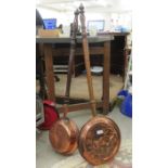 Two late Victorian copper warming pans, on turned, fruitwood handles