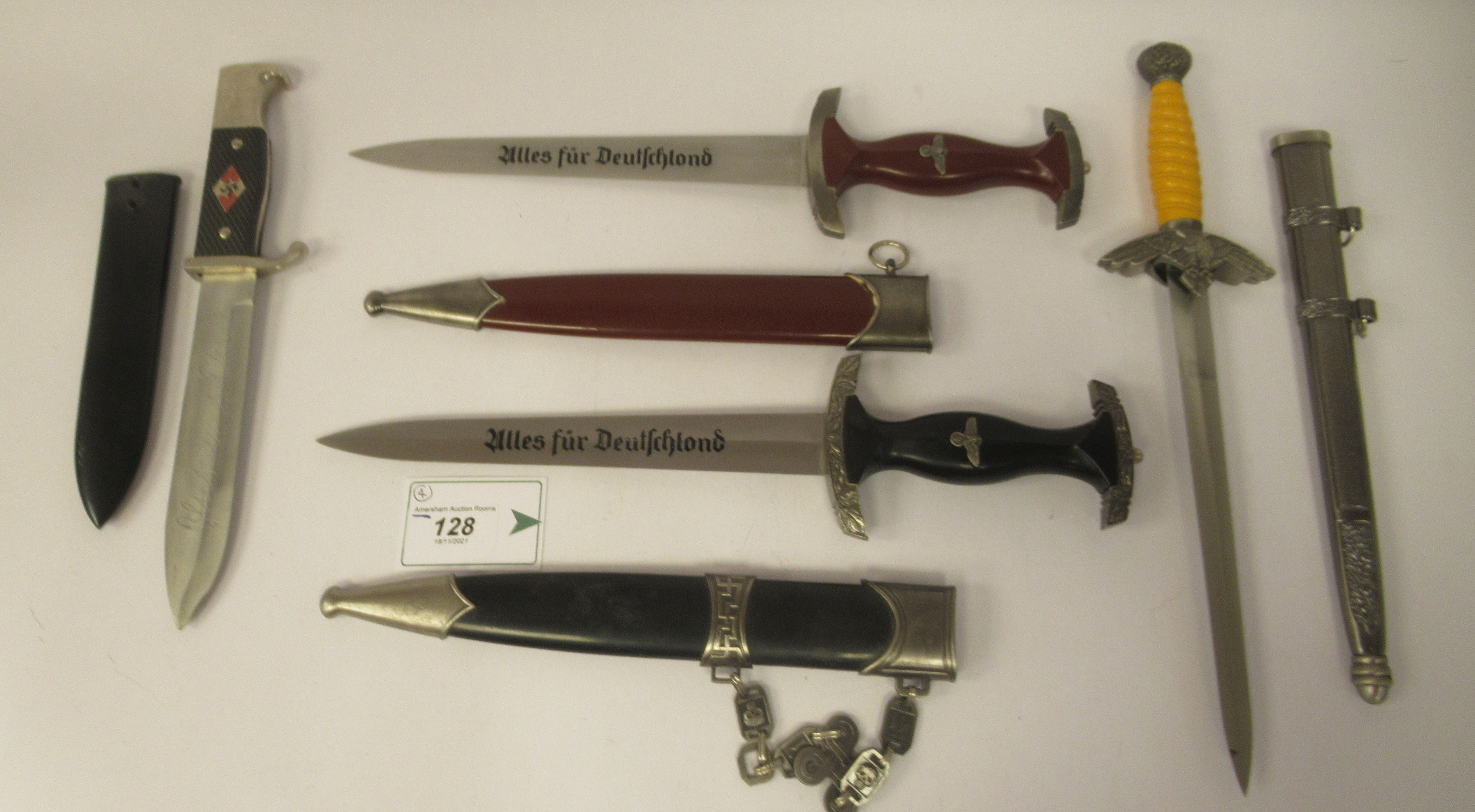 Four replica Third Reich era bladed weapons, viz. a Hitler Youth dagger, in a steel sheath; two - Image 2 of 4