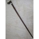 A turned teak walking stick, the handgrip carved with a rearing horse