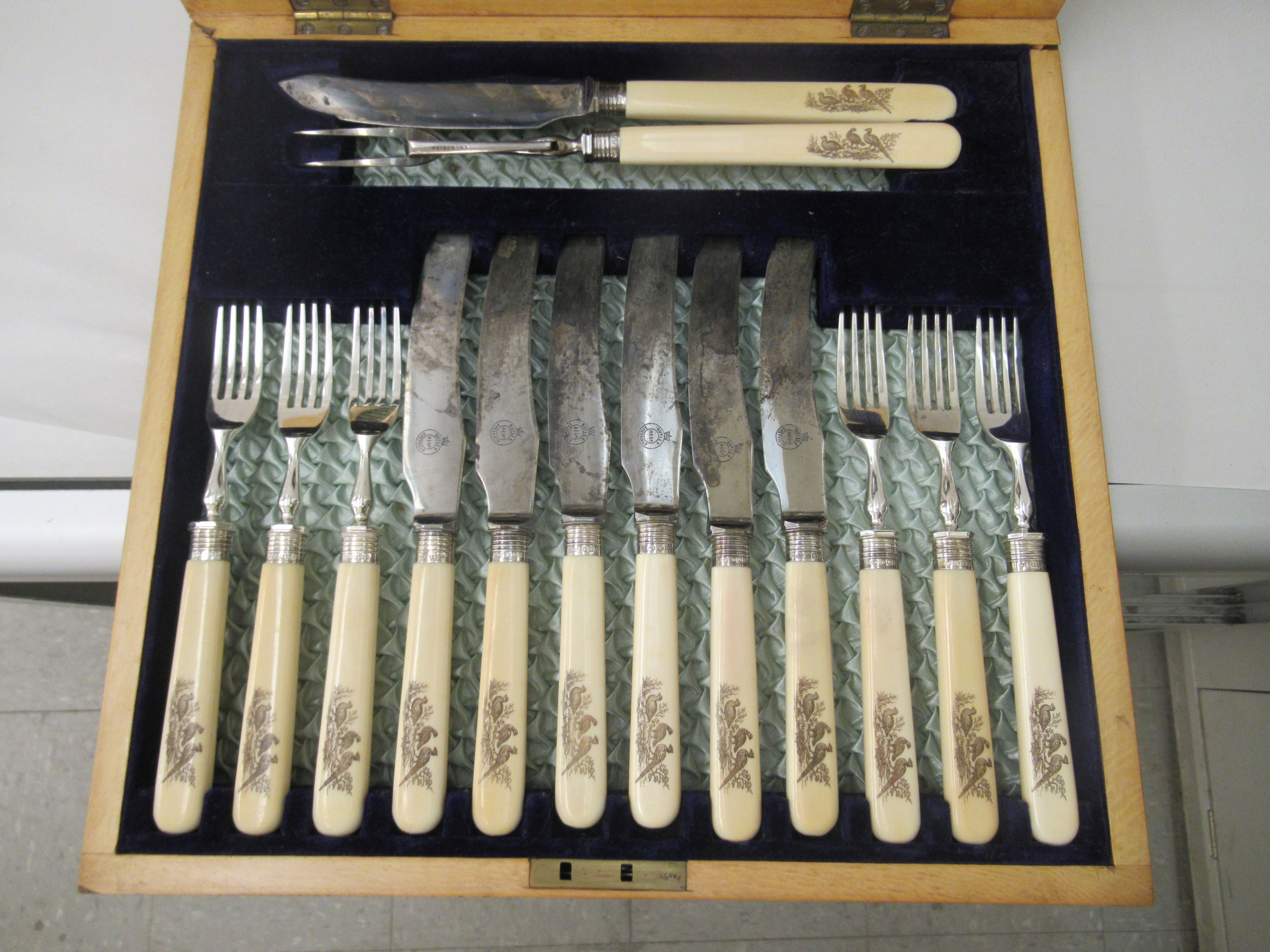 A cased set of twelve Butler of Sheffield knives and forks with ivorine handles and silver ferrules, - Image 2 of 4