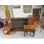 Mid 20thC furniture: to include a nesting set of three teak occasional tables, raised on square,