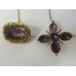 A late Victorian yellow metal mourning brooch and a yellow metal mounted amethyst set brooch