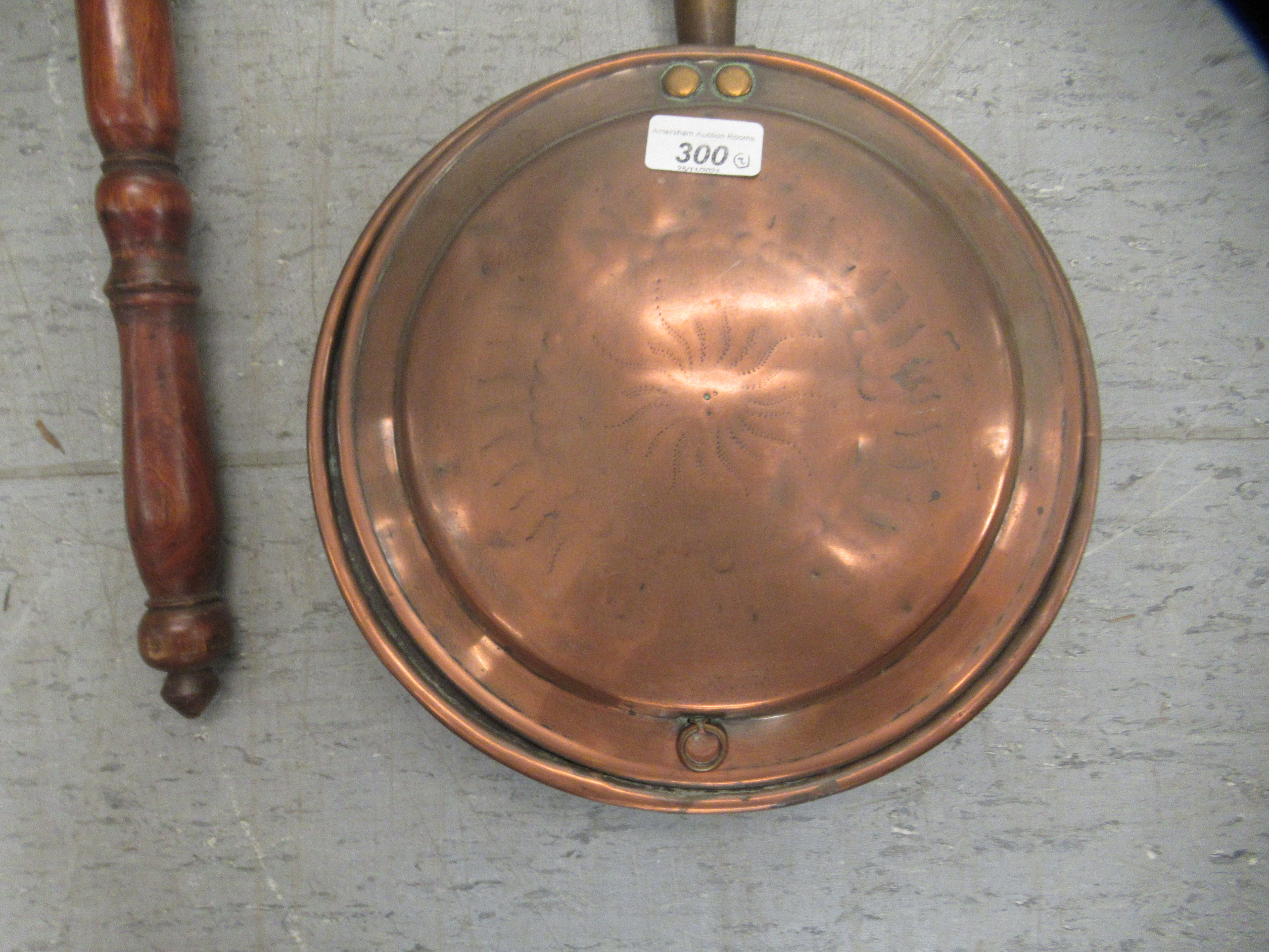 An early 19thC copper and brass warming pan with a scratch engraved design on the lid, on a turned - Image 2 of 3