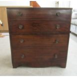 A George III mahogany commode, fashioned as a four drawer dressing chest, raised on bracket feet