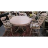 A modern bleached pine pedestal breakfast table  30"h  43"dia extending to 59"dia with an integral