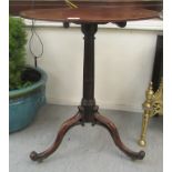 A Regency mahogany pedestal table, the tip-top over a fluted and reeded column, raised on scrolled