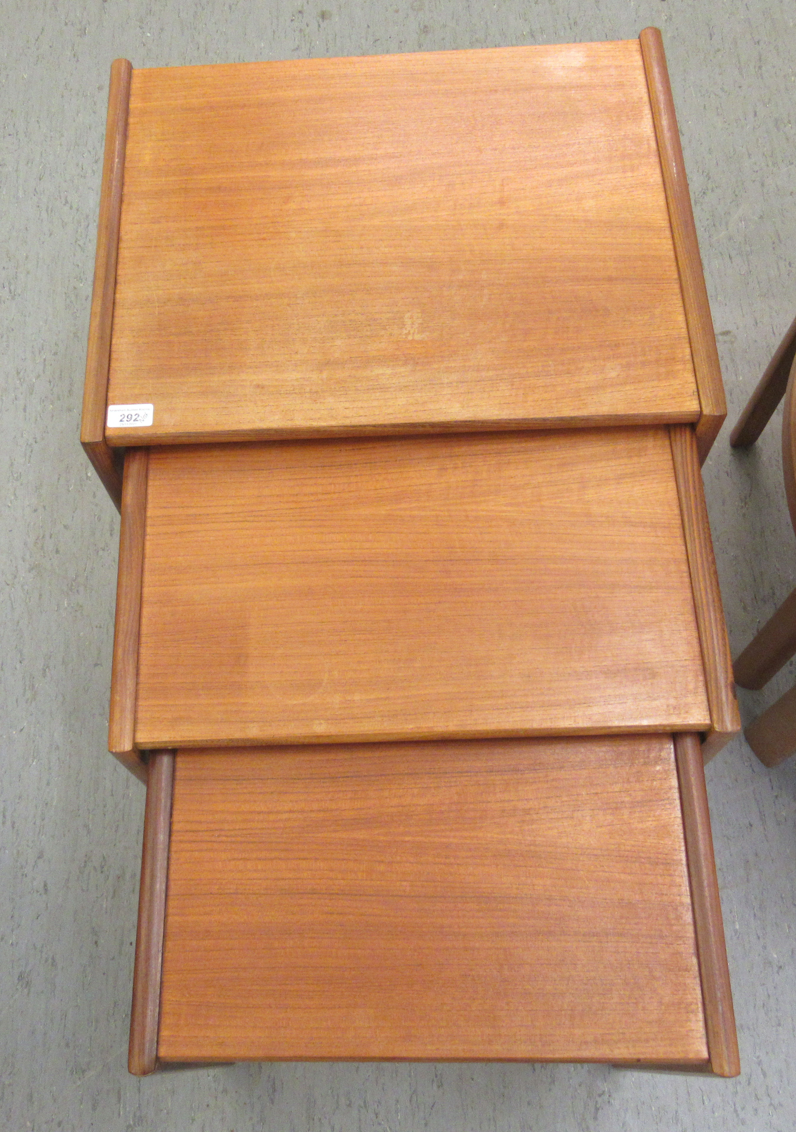 A nesting set three 1970s teak occasional tables, raised on splayed end supports  largest 19"h  21"w - Image 3 of 5